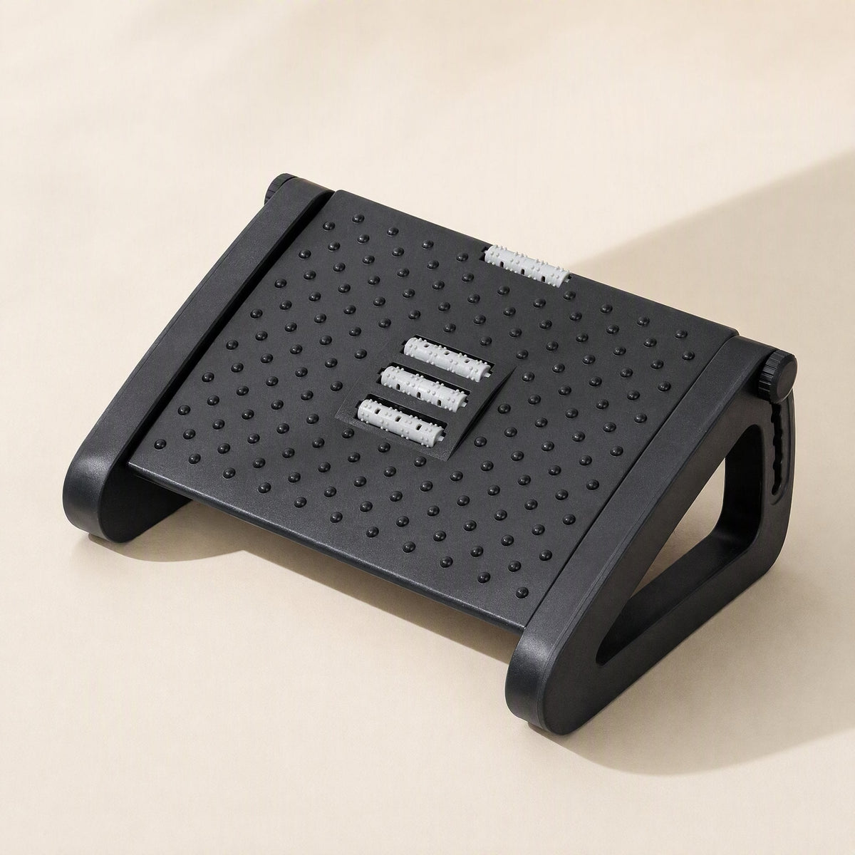 Plastic adjustable triangular footrest stool